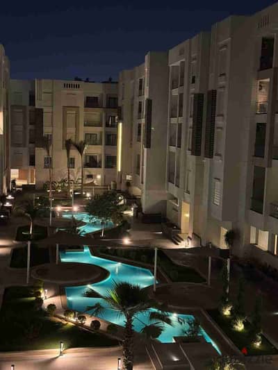 A fully finished apartment with air conditioning and kitchen directly in front of Madinaty