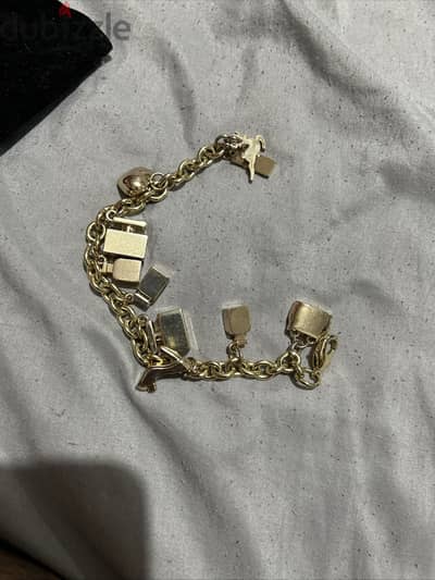 Stunning Dolce & Gabanna gold tone charm bracelet