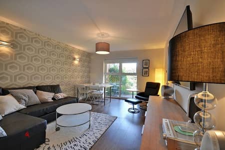 Ground floor apartment with garden, two minutes from the American University and next to Hyde Park, at a special price in Fifth Settlement