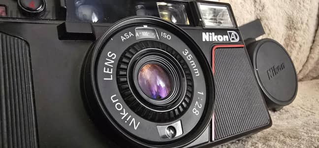 Nikon L35AD (pikaichi) + الجراب الأصلى