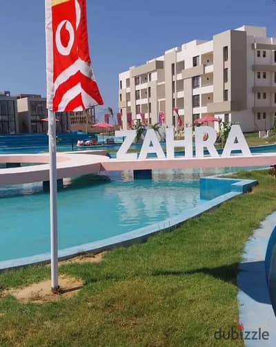 شاليه متشطب بالكامل مباشر علي حمام السباحه للبيع في الساحل الشمالي داخل زهره بجوار هاسيندا