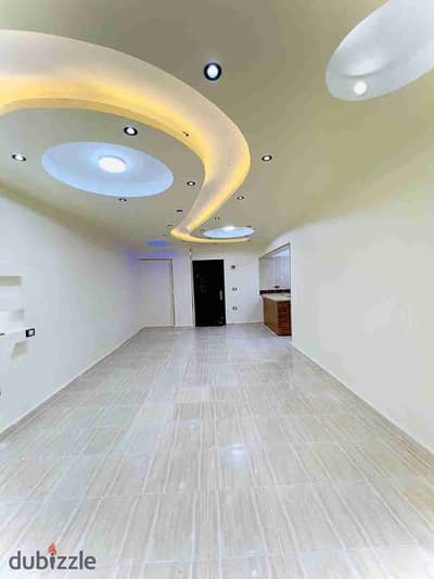 Apartment for sale in Al-Ajami, Palm Beach, next to the main street and KFC, minutes to the sea