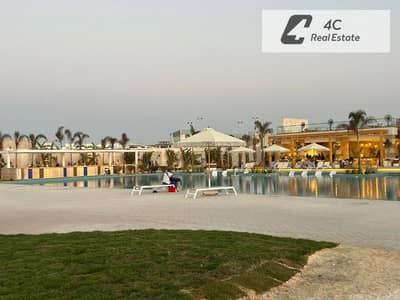للبيع باقل من سعر الشركه شاليه تشطيب كامل كورنر ريسيل في سي شور الساحل الشمالي -open view landscape-lagoon view-بتقسيمه مميزة-جاهز للمعاينه و الاستلام
