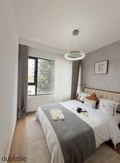 Own your fully finished apartment directly on the 26th of July Corridor and near Mall of Arabia