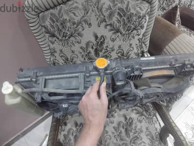 رادياتير لانسر بحالة الزيرو كامل بالمراوح والقربه لتعديل البيجو 504/50