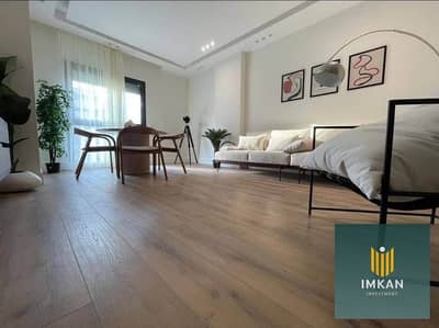 In Fustat, a ready-to-move-in apartment with ultra-super-lux finishing is for sale with a special discount in the Arabesque compound, with a sea view