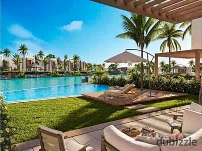شاليه للبيع هاسيندا وترز ارضى بحديقة فيو حمام سباحة Chalet for sale in Hacienda Waters - Directly on lagoon View pool