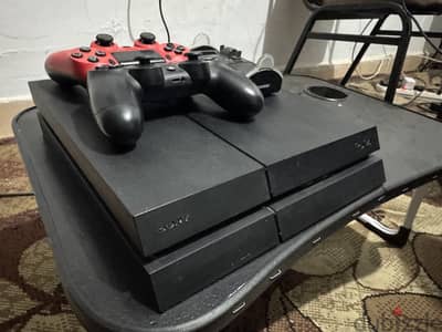 Playstation 4 with 2 controllers and 8 games