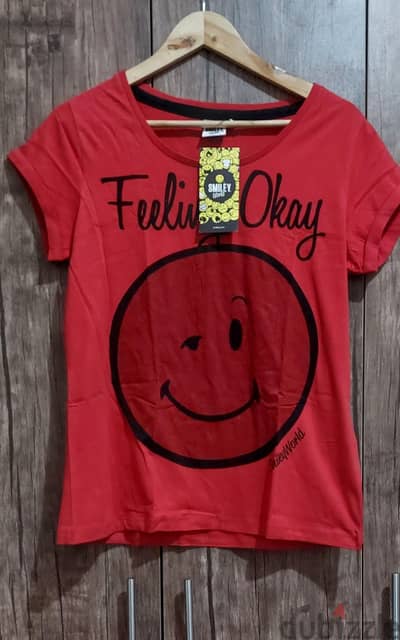 تيشرتات SmileyWorld الأصلي (وارد سنتر بوينت السعودية)