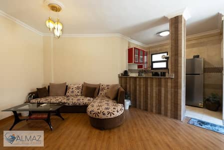 Furnished 75 sqm studio apartment for rent in Group 95, Al Rehab, near main roads.