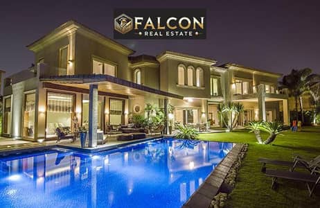 VIP villa with palace-sized space for sale in Swan Lake by Hassan Allam, in the heart of New Cairo, directly on the Suez Road, with installments over