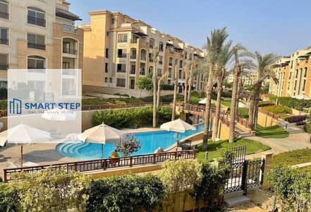 Apartment with garden in very prime location in stone residence new cairo