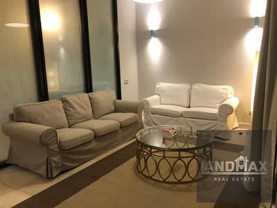 2 BEDROOM APARTMENT WITH GARDEN FOR RENT IN VILLAGE GATE - PALM HILLS NEW CAIRO 5 MINS FROM AUC - LUXURY LIVING MODERN FURNITURE