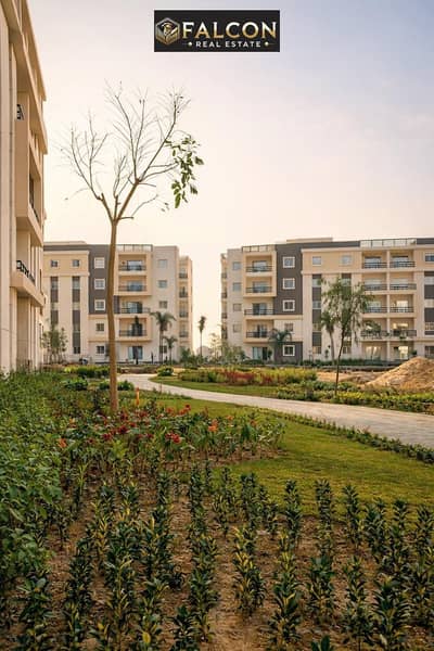 A stunning apartment with a landscape view is for sale in Isola Sheraton Compound, New Cairo, located in Sheraton Airport on the main Al-Sa'eqa Street