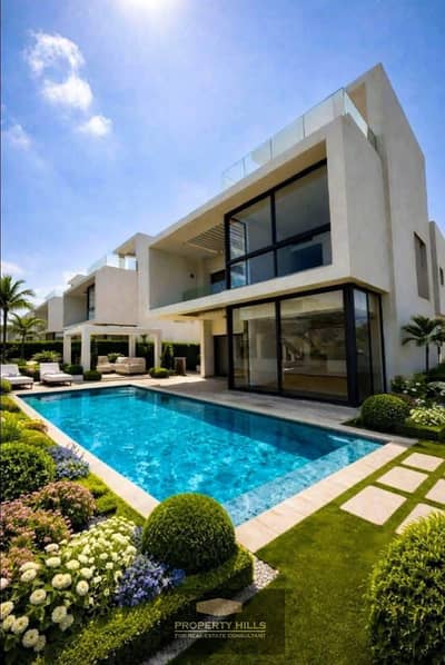 Panoramic villa, 450 meters, 3 floors, with a private swimming pool, facing New Giza, Mountain View Giza Plateau, and Pyramids Heights, October.