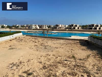 فيلا للبيع في هاسيندا باي الساحل الشمالي تطل علي اللاجون مباشرة