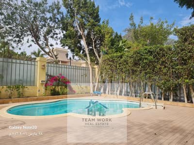 Twin house for sale in Sheikh Zayed, Belle Ville Compound, very prime location on Nozha Street, near Hyper One, super deluxe, with swimming pool.