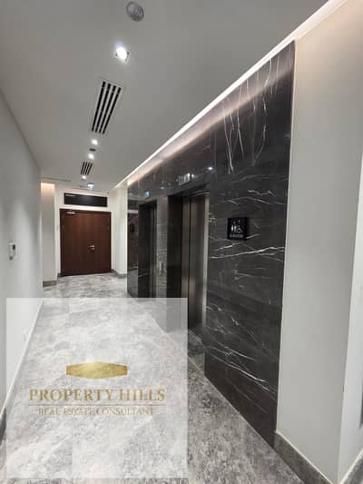 Last office for sale with a 500,000 EGP down payment in Yellow Compound, 1 Settlement Suez Road near the American University Prime location with the