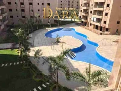 Luxury ultra-modern apartment inside (Al Hayah Town) with a view of the pool