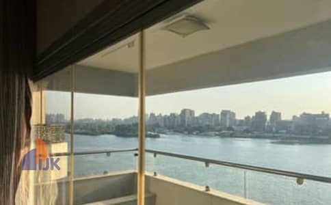 A prime investment opportunity: a commercial shop for sale, ready for immediate occupancy, currently rented for 160,000 EGP per month, with a Nile vi