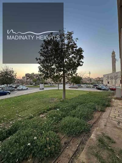 شقة تشطيب راقى أرضي بجاردن للبيع في مدينتي B11 أمام المسجد والخدمات