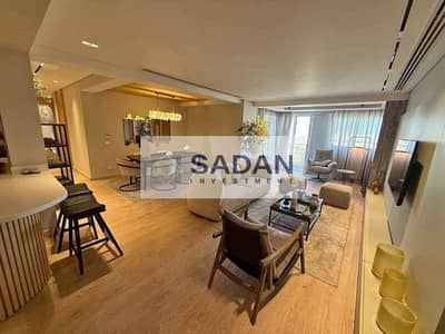 شقة للبيع بخصم 50 % في كمبوند تاج سيتي علي طريق السويس دايركت في أميز مرحلة Origami Golf - Taj City                                                  .