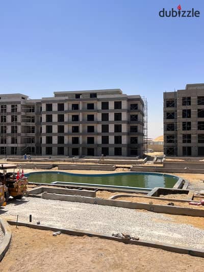 Duplex with a garden overlooking the swimming pool for sale in a prime location in New Zayed, inside DeJoya, with near delivery.