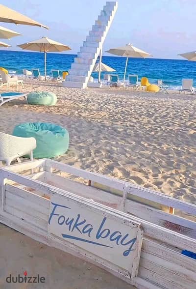 Chalet for sale, first row on the sea with a view of the most beautiful beach in Ras El Hekma Bay, near New Alamein, in Fuka Bay village.
