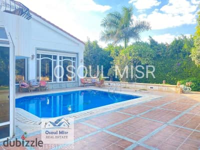 Villa for sale in Al Rabwa Sheikh Zayed with a swimming pool overlooking the golf course
