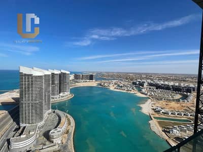 Apartment for sale Ready to move, overlooking the sea and lagoon, on the 20th floor of The Gate - Alamein Towers, fully finished.