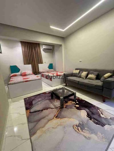 For rent: double studio in the first neighborhood near 3, furnished VIP in 6th of October City next to Al-Hosari and 6th of October University. 2 beds, room, bathroom, and a kitchen with an air conditioner on a raised ground floor.