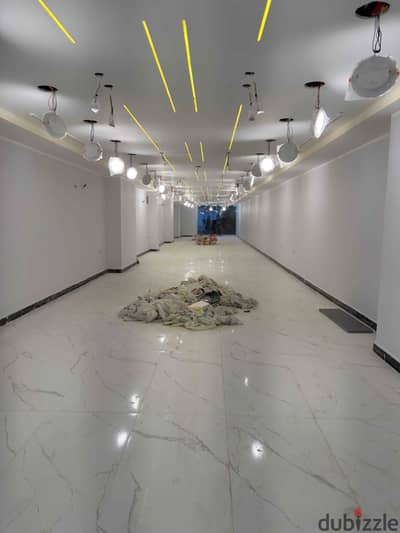 Shop for rent on Al Haram Main Street, 300 sq m, with a prime location suitable for brands and commercial agencies.