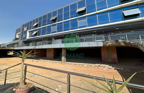 محل دور ارضي 143 متر متشطب بالتكييفات للايجار في مول زايد ديونز علي شارع الشباب مباشرة