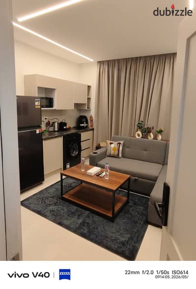 Furnished studio for rent in the Fifth Settlement in Al-Nargis Towers, elevated ground floor, first occupancy