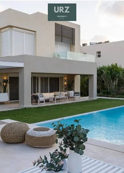 Townhouse with sea and lagoon view fully finished + ACs for sale at a special price in Ras El Hekma near Sea Shore Shell Mountain View Ogami Silver
