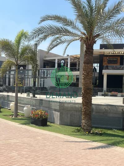 محل واجهه بالكامل 200 متر متشطب للايجار قلب الشيخ زايد على شارع الشباب مباشرة بمول اتريوم - elsheikh zayed