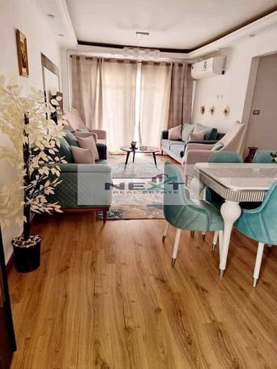 For rent in Madinaty - Furnished. Floor: 5th. Area: 96 sq m. Zone: B7. Layout: 2 bedrooms + 2 bathrooms. View: Park. Close to services. Price: 25,000\