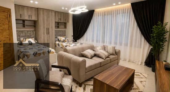 Studio for sale Mohandessin Tiba Street behind Kadoura 80 sqm comfortable reception prime location investment opportunity ready to move