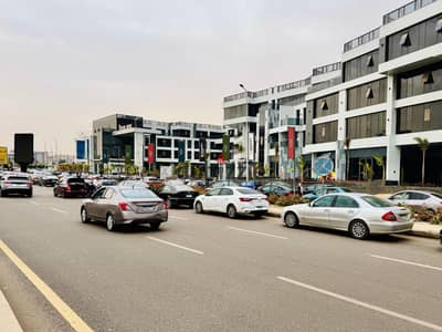 Store for sale in the heart of Zayed 165 meters with an external area of 105 meters facing Al-Bustan Street in front of American Plaza