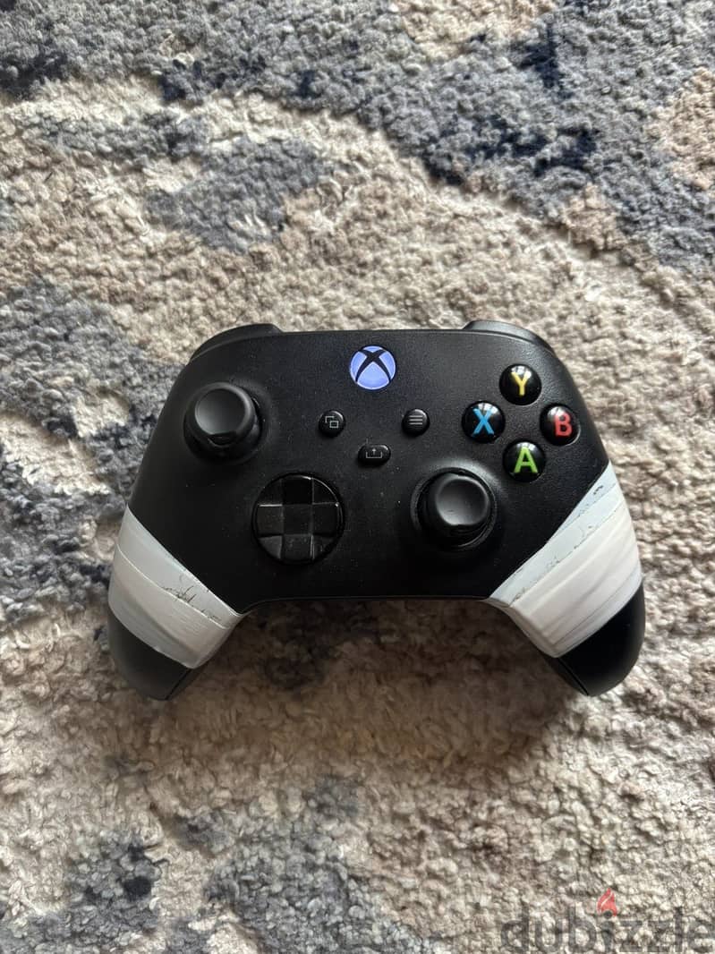 xbox with cartoon and one controller 5
