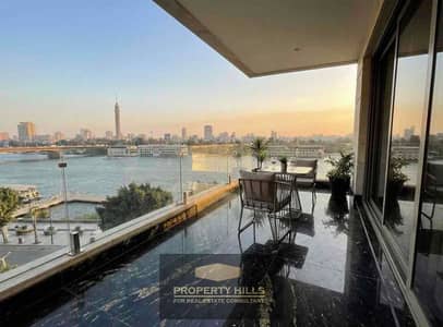 Furnished hotel apartment with air conditioning, appliances, and furniture on the 16th floor on the Corniche of Maadi Nile View with an investment return in dollars near Zamalek, Garden City, 9th Street, and Degla Street in Maadi