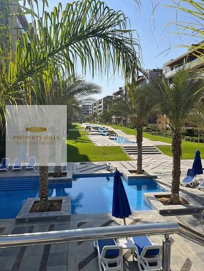 Ready-to-deliver apartment in Al Patio Oro Compound from La Vista in Fayoum, open to water features, prime location directly on Bin Zayed Axis in New Cairo.
