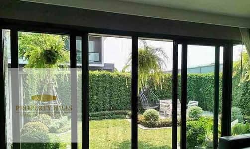 Fully finished at a low price villa  advance (1,212,950)  in the Fifth Settlement compound  villas only with a landscape view in installments next to the American University, Tlal East