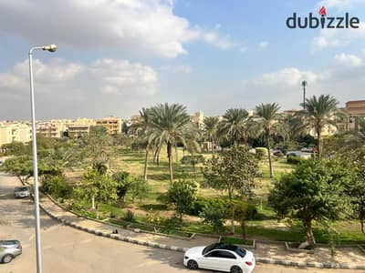 For sale in Al Banafseg Villas, a 210 sq m ground floor apartment with a garden view, semi-finished.