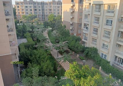 Apartment for sale with garden view, ready to move, in a prime location in Madinaty