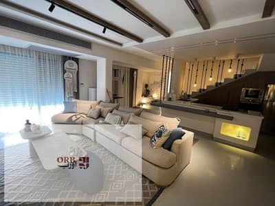 Penthouse for sale in Azha North Coast, 77 sqm + 179 sqm roof, lagoon view, fully finished inside serviced project with lagoons and security.