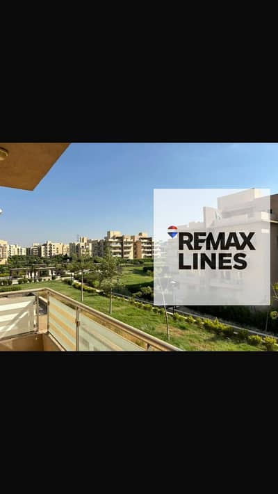 Apartment for sale in Wosal Compound, Al-Shorouk City, wide garden view near the compound entrance from Al-Shorouk and the British University
