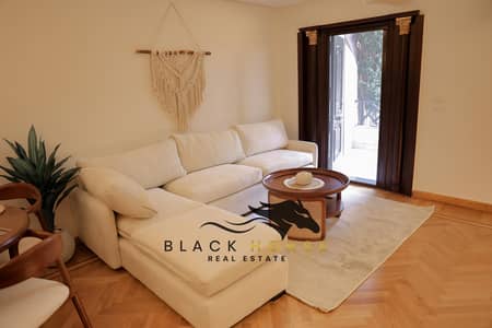 Brand-New Furnished 2BR Ground Floor Apartment with Garden for Rent in Al Rehab