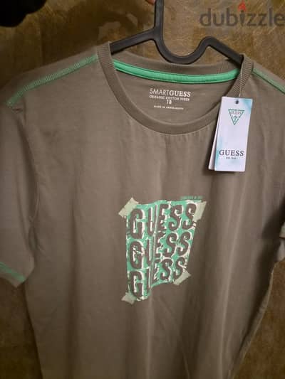 Guess t shirt from dubai size 18 years old
