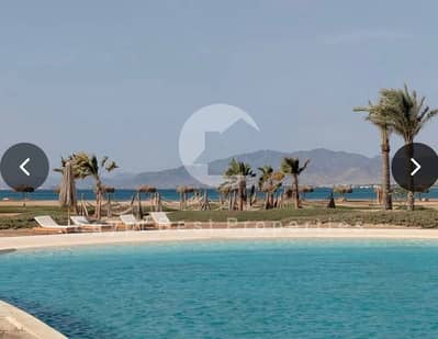 خصم 22% علي اخر شقة 2 غرفة إطلالة لاجون | تشطيب كامل + تكييفات+حمام+مطبخ | New Gouna مكادي هايتس أوراسكوم | من 0% مقدم | 9 سنوات